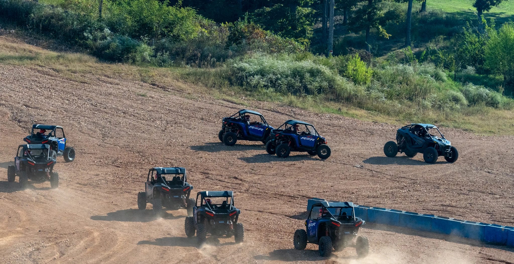 Group of off-road vehicles on track